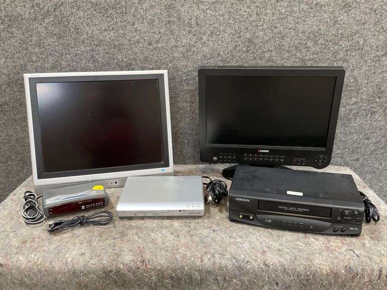 A Computer Screen,Sharp Tv, DVD/VHS Players And A Clock 777 Auction