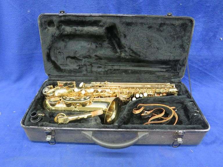 Saxophone in a case. Appears to be in excellent condition. Marked "Hawk