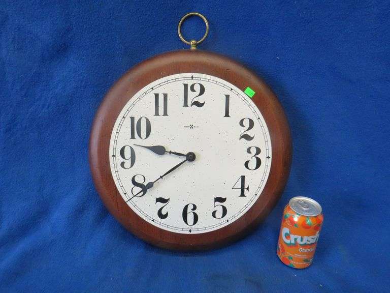 Howard Miller batteryoperated working walnut wall clock AAA Auction