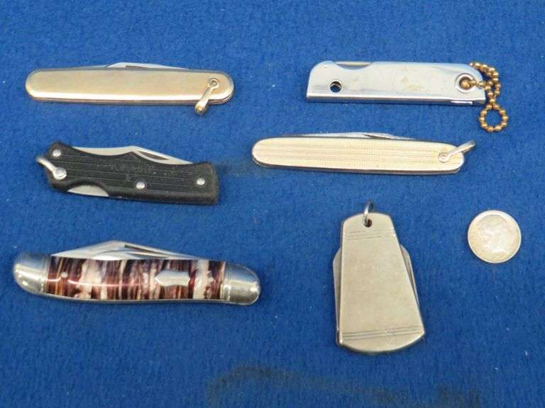 Five collectible small folding knives including one Imperial AAA