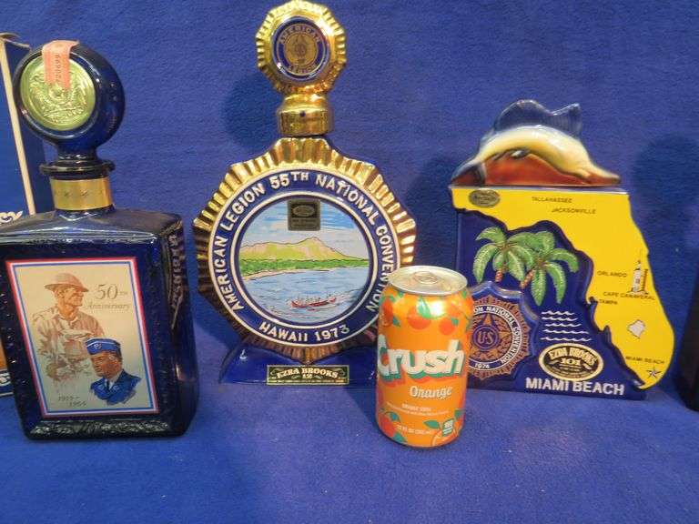 Five empty liquor decanters from American Legion National Conventions