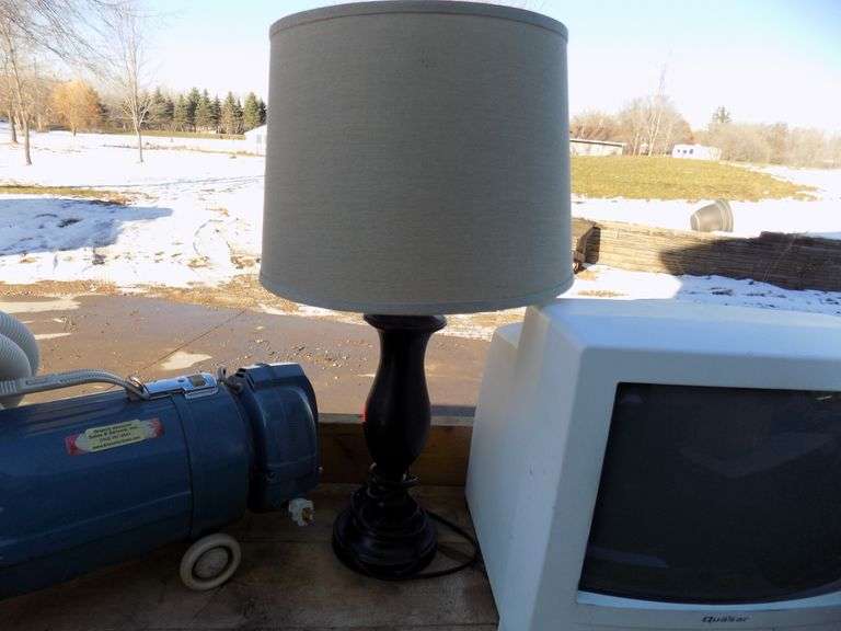 Electrolux vacuum, lamp, garbage can, and monitor/VCR AAA Auction and