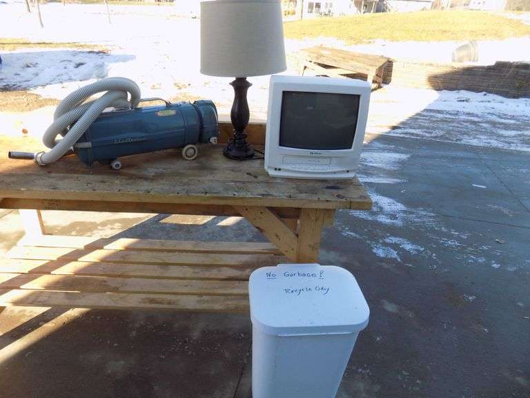 Electrolux vacuum, lamp, garbage can, and monitor/VCR AAA Auction and