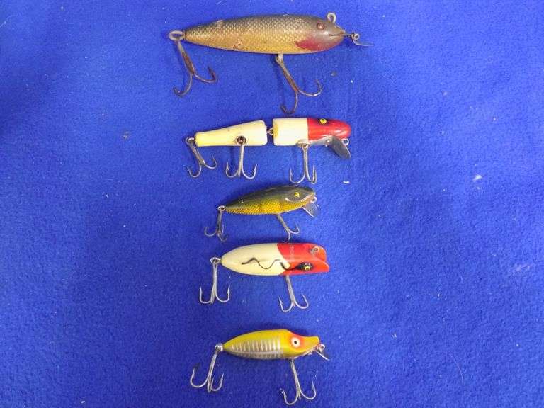 Old fishing lures and a tackle box AAA Auction and Realty