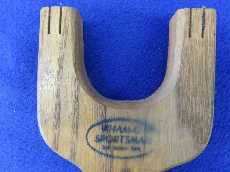 Vintage metal box with gun cleaning supplies and an old slingshot AAA