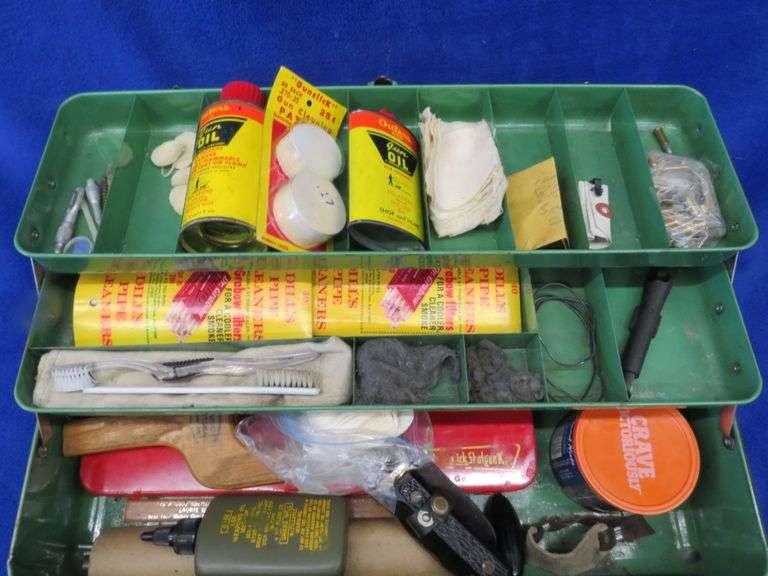 Vintage metal box with gun cleaning supplies and an old slingshot AAA