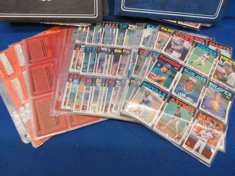 Two folders of baseball cards as described below AAA Auction and Realty