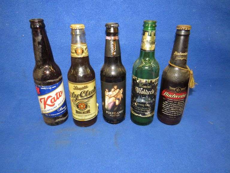 Five old beer bottles three unopened AAA Auction and Realty
