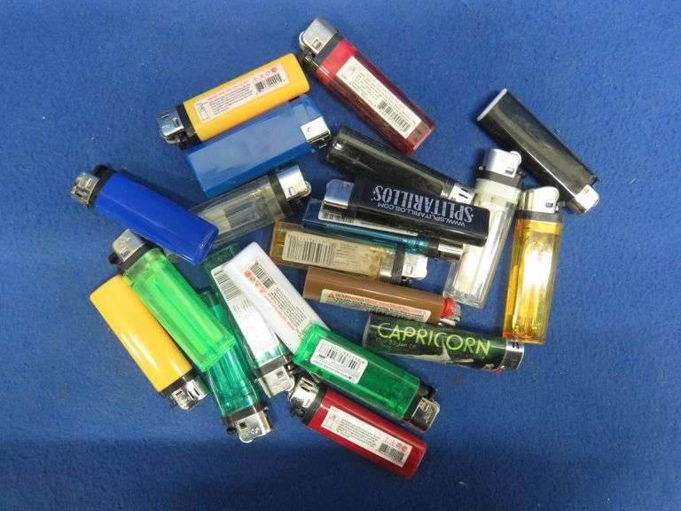 21 cigarette lighters, all with fluid AAA Auction and Realty
