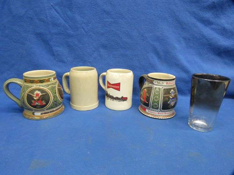 Four Budweiser beer mugs and a Budweiser beer glass AAA Auction and