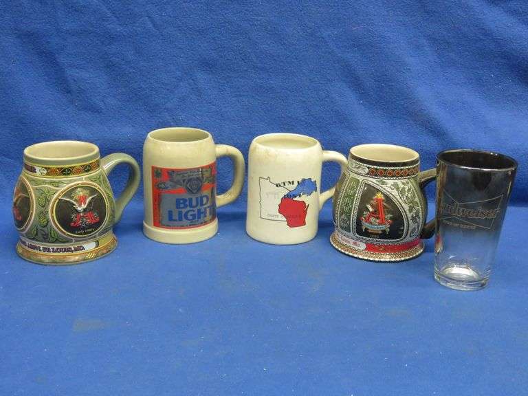 Four Budweiser beer mugs and a Budweiser beer glass AAA Auction and