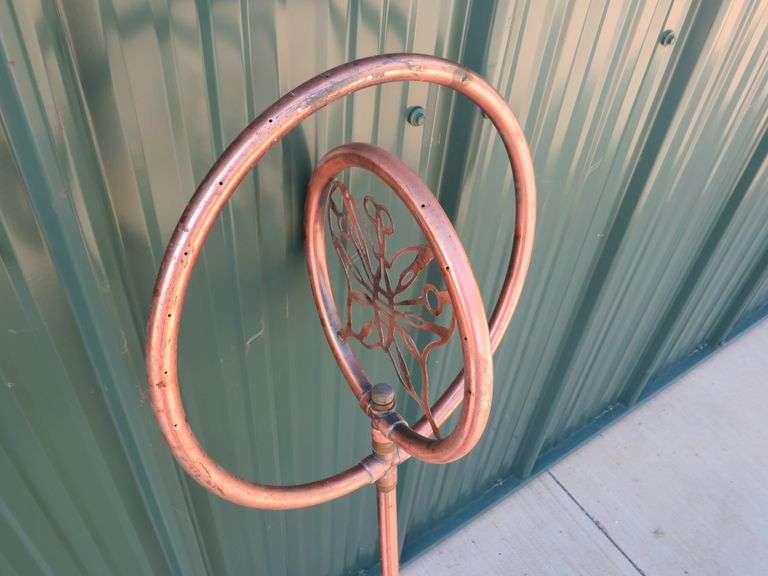 Spinning copper sprinkler AAA Auction and Realty