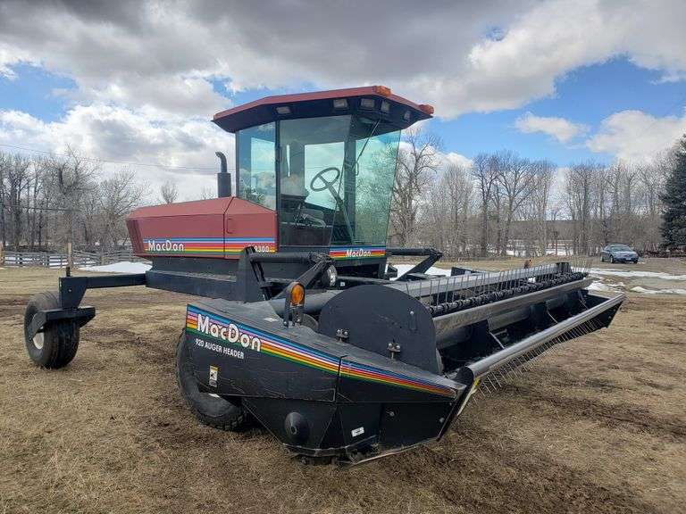 1999 MacDon 9300 swather w/ 14' MacDon 920 Auger header