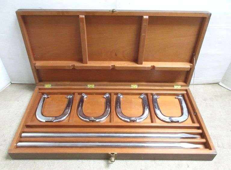 Custom chrome plated horseshoes and stakes in a wooden box, two