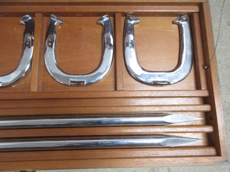 Custom chrome plated horseshoes and stakes in a wooden box, two