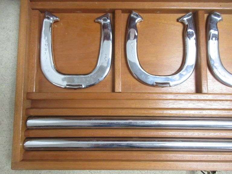 Custom chrome plated horseshoes and stakes in a wooden box, two