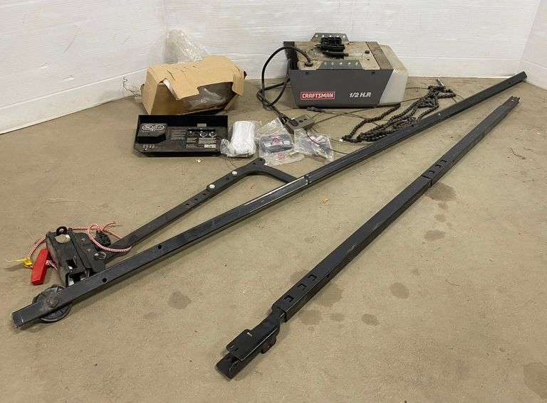 1/2 HP Craftsman garage door opener, rails and remotes included, good