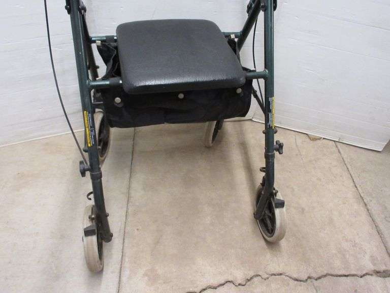 Invacare walker with seat, seat 12"W x 12"H, good condition Albrecht Auction Service