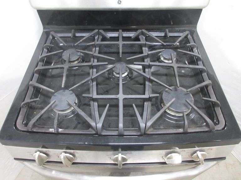 GE 30" gas range, set for natural gas can be used with propane, works