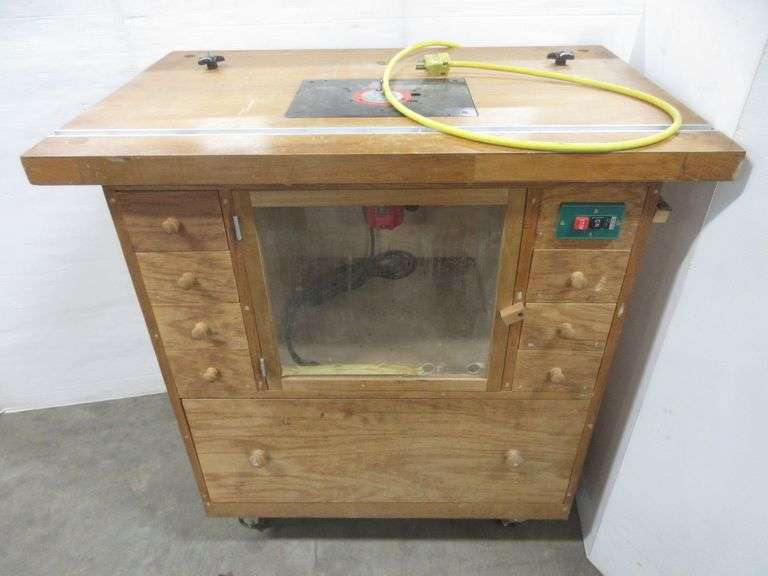 Custom made router drawers filled with router cutters, molding cutters, guide