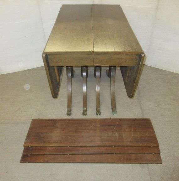 Antique claw foot dining room table with (3) leaves and drop down sides
