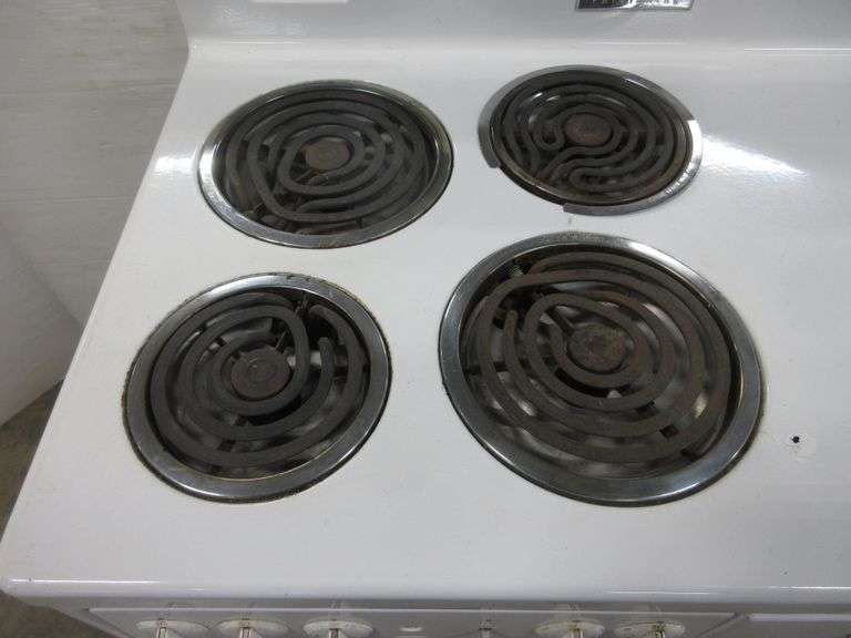 Older Frigidaire electric stove, four burners and oven, 38"W x 24"D x