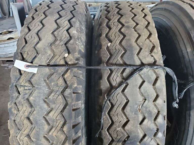 (2)10.00R20 Recap Tires; (2)10.0020 Nutech Tires on Open Rims. Comes