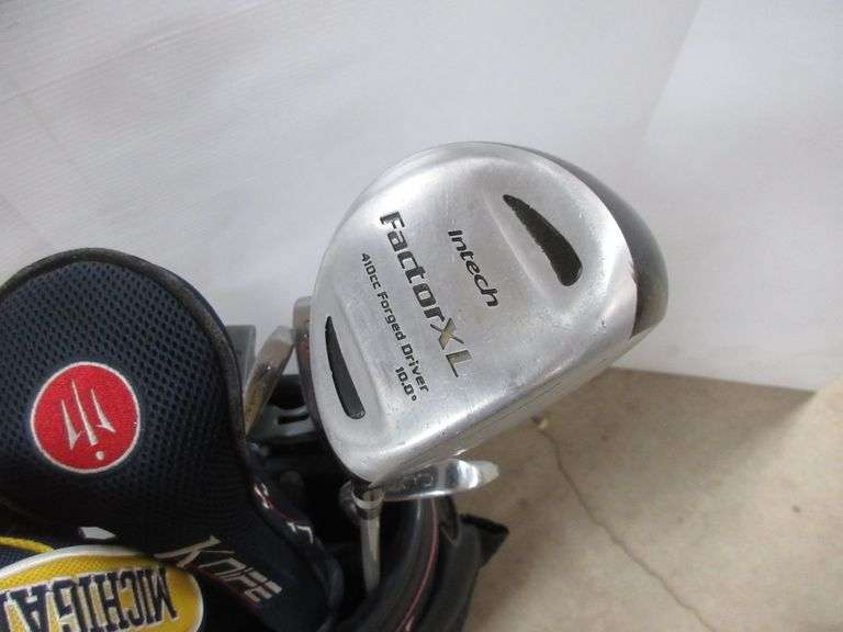 Set of Titleist Tour model golf clubs, includes P, 2, 3, 4, 5, 6, 7, 8