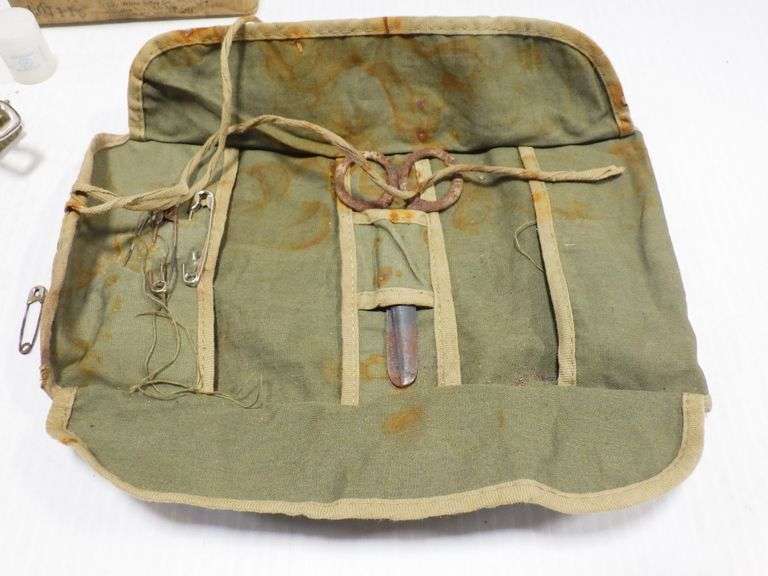 First aid field dressing, troop camo, WWII ; Sewing kit from WWII