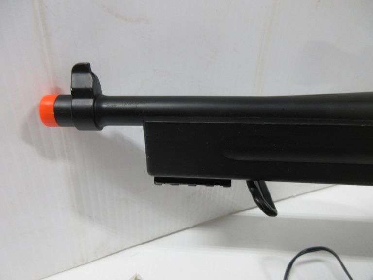(2) Airsoft guns, include Spring powered shotgun with red dot sight