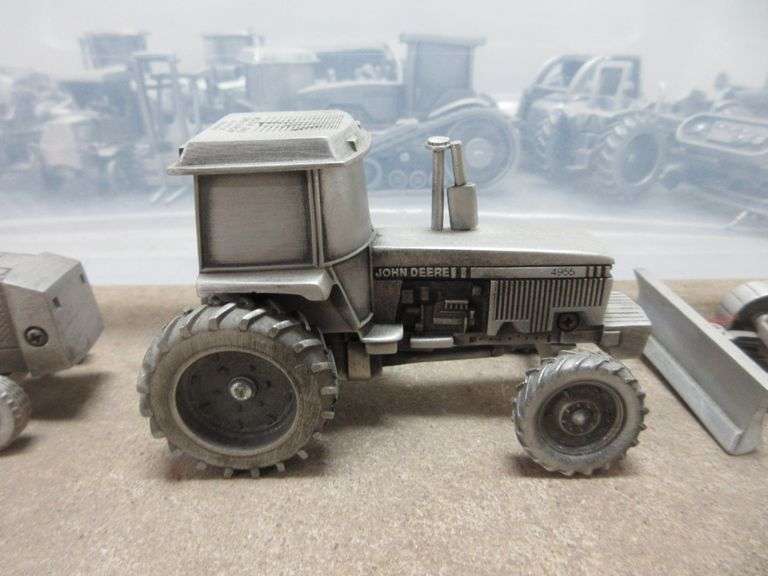 Pewter John Deere toy tractors, implements, and construction equipment