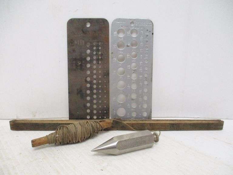 Plumb bob, (2) drill bit sizers, and an antique ruler Albrecht