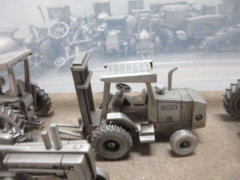 Pewter John Deere toy tractors, implements, and construction equipment