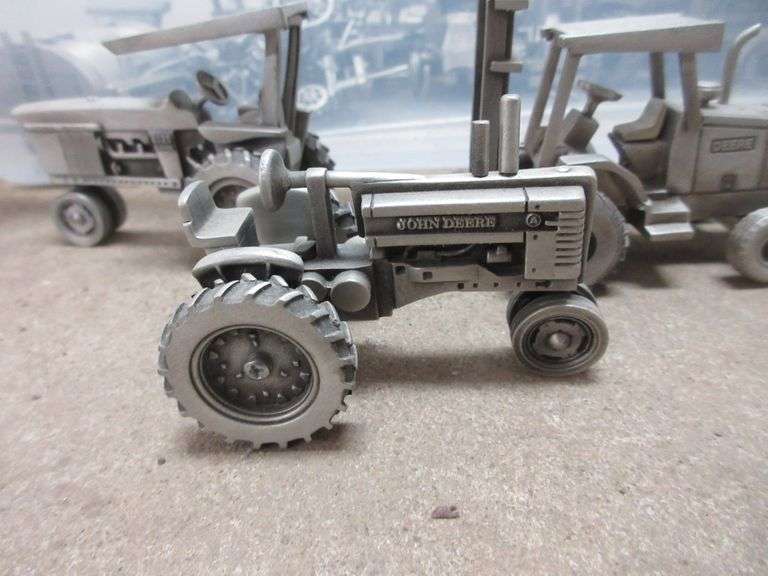 Pewter John Deere toy tractors, implements, and construction equipment