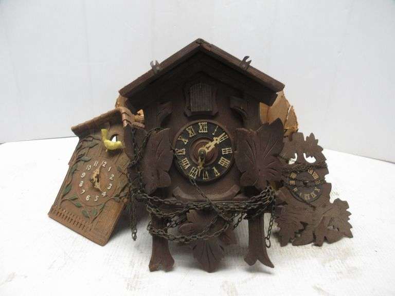 Box of cuckoo clocks, parts, and pieces, for parts or repair, as is