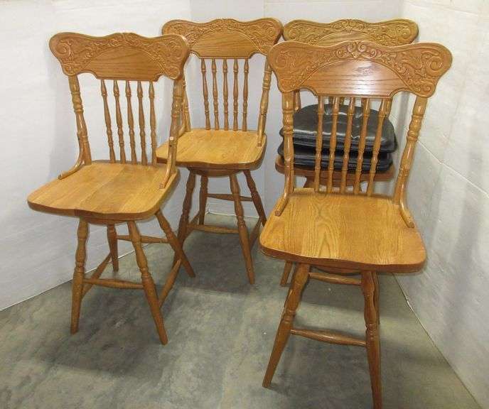 (4) Matching oak spindle back swivel bar stools, comes with (4) seat