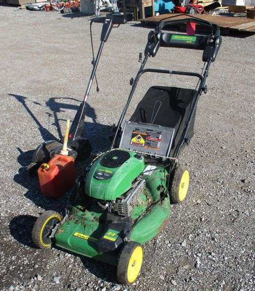 John Deere 22" lawn mower with bagger, runs, deck is getting rusty; Gas can; Craftsman electric