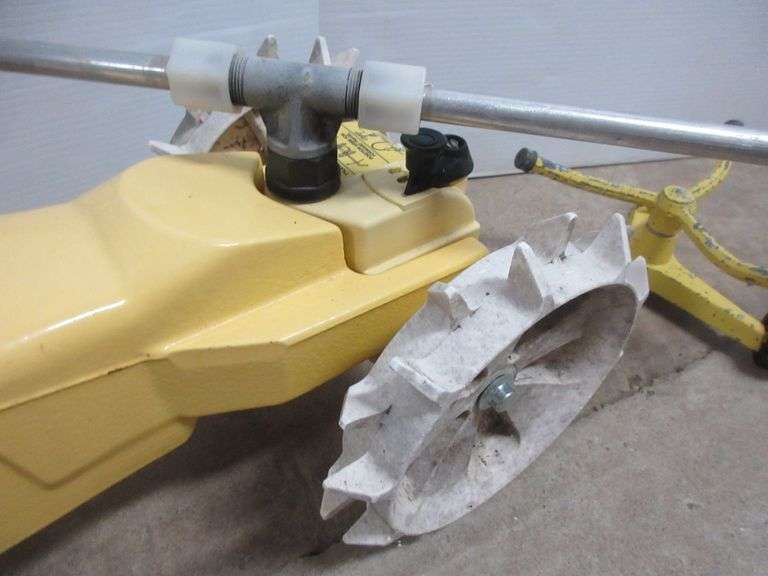 (2) Yellow Nelson lawn sprinklers, includes Rain train cast iron