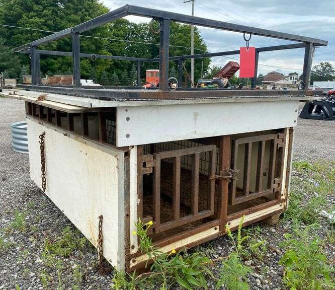 Dog box, has rig rack on top, rig holes on sides for dogs head to stick out, doors on sides that