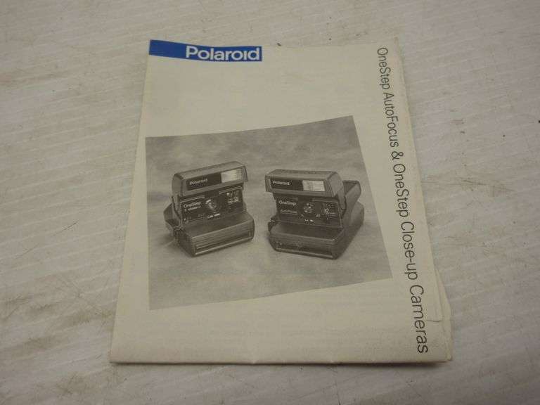 One Step Polaroid camera with instructions; Polaroid Spectra with