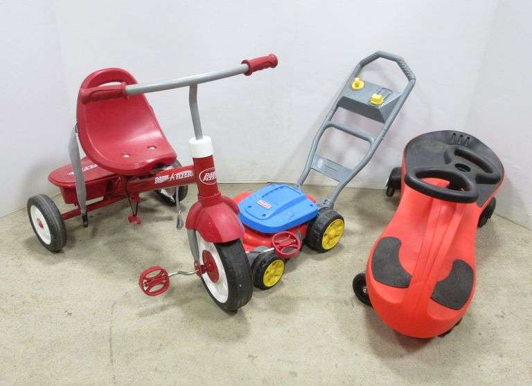 Radio Flyer tricycle, used; Plasma car, used; Fisher Price lawn mower