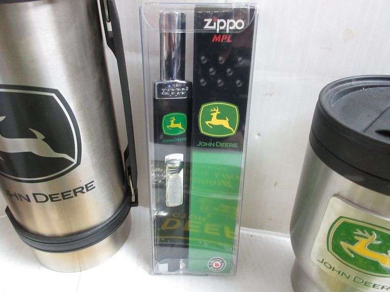 (2) John Deere license plates, Piston koozie, Zippo, Mugs, and Thermos