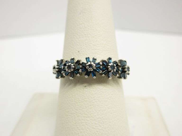 Genuine blue diamond engagement/wedding ring with five flowers across
