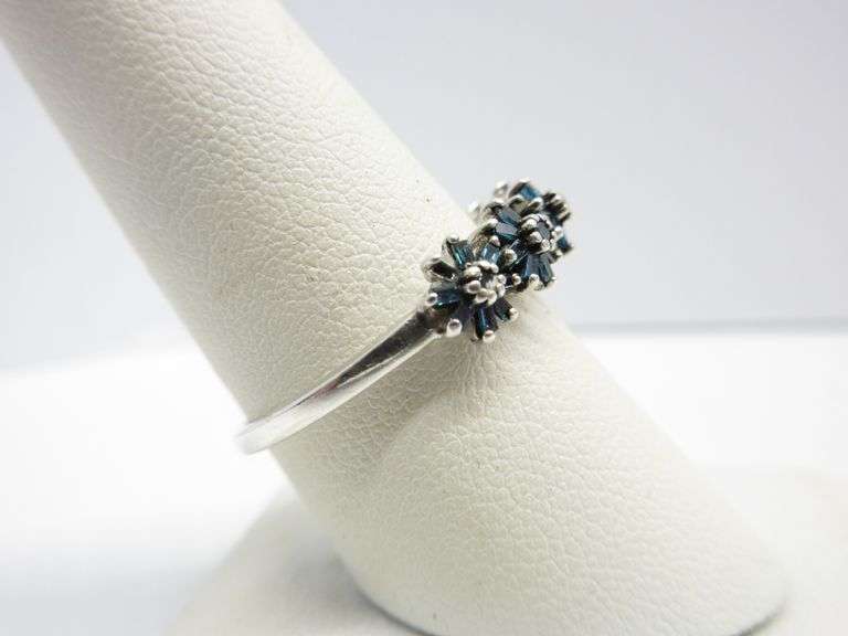 Genuine blue diamond engagement/wedding ring with five flowers across