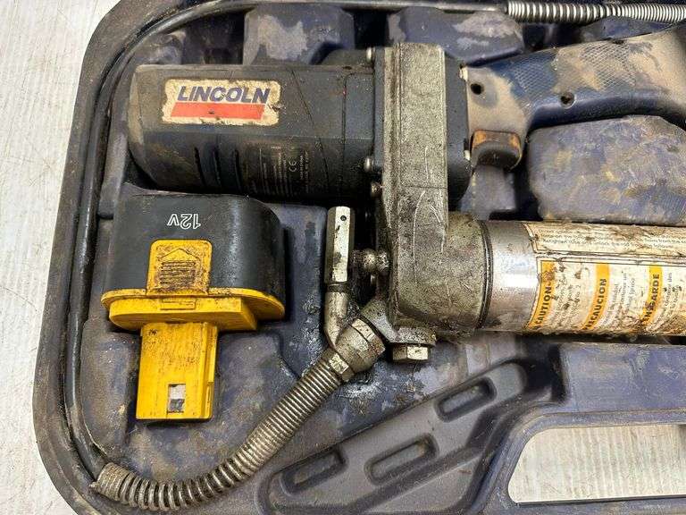 Lincoln grease gun, battery charger, and case, works as it should