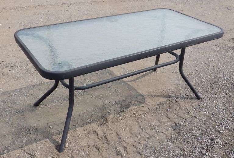 Glass outdoor table, 40"W x 20"D x 18"H, great Albrecht Auction Service