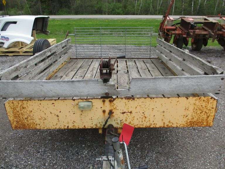 Utility trailer, tolt bed, drop gate, hand winch, newer tires, has a