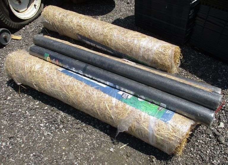 (3) Rolls of black weed barrier; (3) Rolls of straw for grass planting