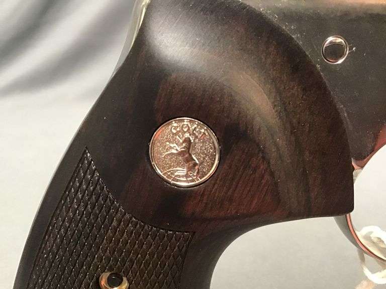 Colt Python .357 Mag. revolver, stainless steel with wood grips, case