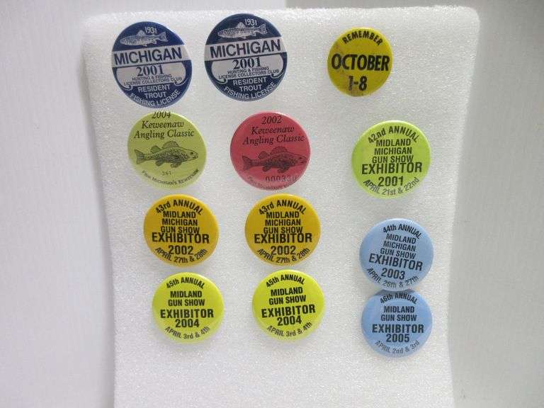 (12) Collectible buttons, 1 Trout fishing license, 1 Keweenaw Angling